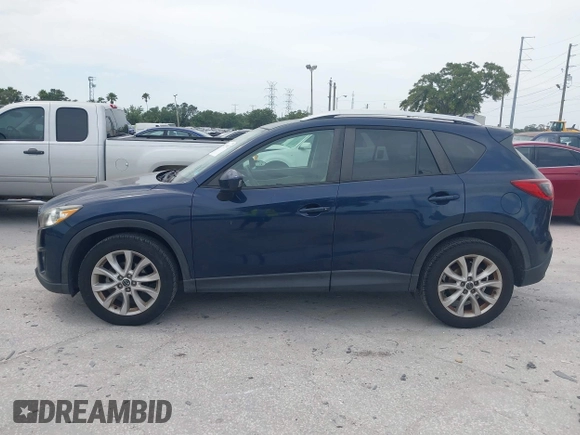 2014 Mazda CX-5 Grand Touring with VIN JM3KE2DY8E0425258, listed as a IAAI auction lot 42179452 with 132,137 mi miles. Bid and sale history available at carsss.com. Image 14.