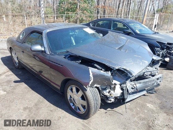 2003 Ford Thunderbird Deluxe z VIN 1FAHP60A23Y101899, wystawiony jako IAAI lot #41805269 z przebiegiem Nie podano mil oraz . Historia ofert i sprzedaży dostępna na DreamBid. Obrazek 1.