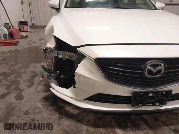2016 Mazda Mazda6 i Sport with VIN JM1GJ1U54G1473671, listed as a IAAI auction lot 41576038 with 88,386 mi miles. Bid and sale history available at carsss.com. Image 6.