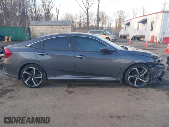 2019 Honda Civic Sport with VIN 2HGFC2F8XKH503867, listed as a IAAI auction lot 41533506 with 66,650 mi miles and . Bid and sale history available at DreamBid. Image 13.