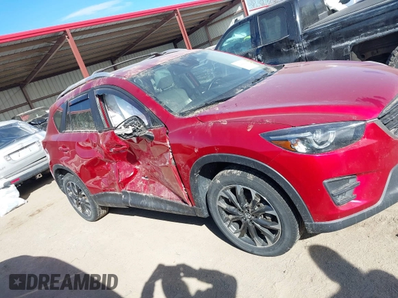 2016 Mazda CX-5 Grand Touring with VIN JM3KE4DY0G0709563, listed as a IAAI auction lot 41886956 with 156,769 mi miles. Bid and sale history available at carsss.com. Image 14.
