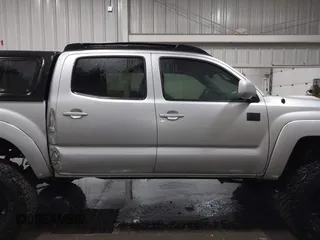 2011 Toyota Tacoma with VIN 3TMLU4EN9BM070836, listed as a IAAI auction lot 41668595 with 89,879 mi miles and . Bid and sale history available at DreamBid. Image 13.