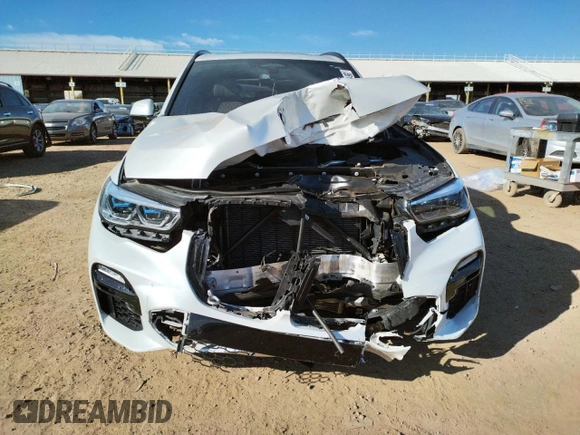 2020 BMW X5 M50i with VIN 5UXJU4C00L9B77869, listed as a Copart auction lot 36123043 with 27,195 mi miles. Bid and sale history available at carsss.com. Image 5.