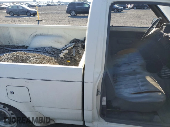 1990 Toyota Pickup with VIN JT4RN81R1L0049863, listed as a Copart auction lot 42832405 with 230,913 mi miles and Salvage title. Bid and sale history available at DreamBid. Image 11.