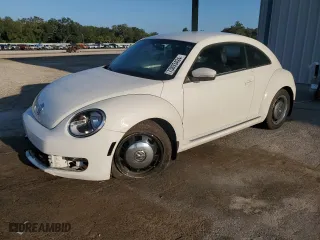 2012 Volkswagen Beetle 2.5L with VIN 3VWJX7AT1CM663786, listed as a Copart auction lot 73893424 with 34,626 mi miles and Salvage Title. Bid and sale history available at carsss.com. Image 1.