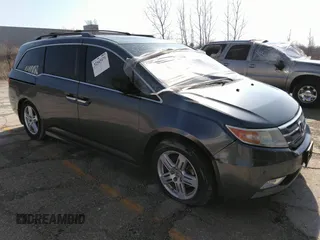 2011 Honda Odyssey Touring with VIN 5FNRL5H91BB027355, listed as a IAAI auction lot 32343471 with 230,254 mi miles and . Bid and sale history available at DreamBid. Image 1.