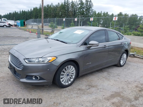 2014 Ford Fusion SE Hybrid with VIN 3FA6P0LU6ER285188, listed as a IAAI auction lot 42516215 with 122,899 mi miles and . Bid and sale history available at DreamBid. Image 2.