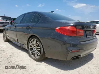 2019 BMW 5 Series M550i xDrive with VIN WBAJB9C51KB287797, listed as a Copart auction lot 65382465 with 61,459 mi miles and Salvage title. Bid and sale history available at DreamBid. Image 2.