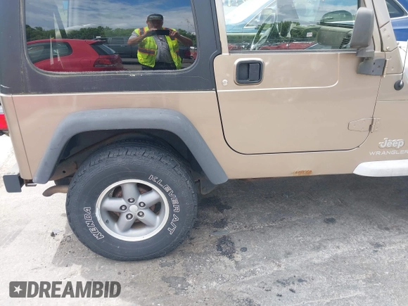 2005 Jeep Wrangler Sport with VIN 1J4FA49SX5P317120, listed as a IAAI auction lot 42677397 with 71,403 mi miles and . Bid and sale history available at DreamBid. Image 19.