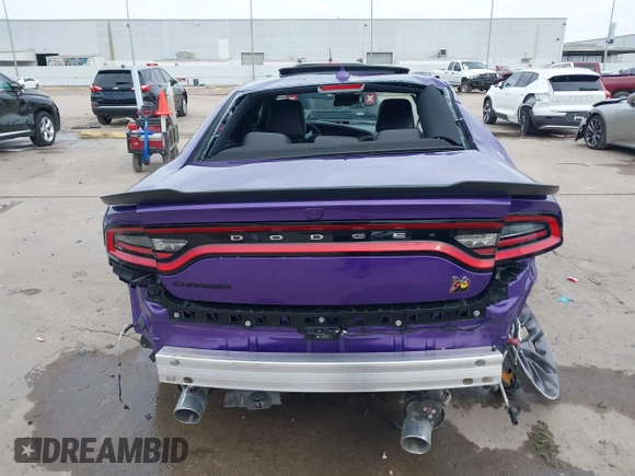2023 Dodge Charger Scat Pack Widebody with VIN 2C3CDXGJ5PH699595, listed as a IAAI auction lot 41303894 with 1,828 mi miles and . Bid and sale history available at DreamBid. Image 17.