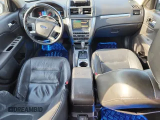 2010 Ford Fusion Hybrid with VIN 3FADP0L33AR131403, listed as a Copart auction lot 65476625 with 188,498 mi miles and Salvage title. Bid and sale history available at DreamBid. Image 8.