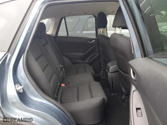 2016 Mazda CX-5 Touring with VIN JM3KE4CY4G0778032, listed as a Copart auction lot 52769065 with 81,443 mi miles and Salvage Title. Bid and sale history available at carsss.com. Image 11.
