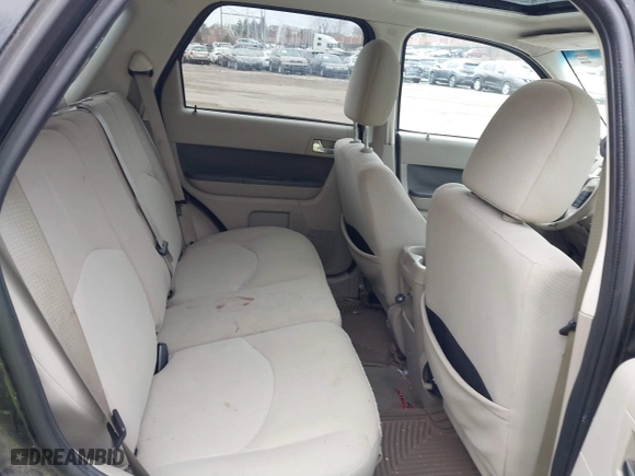 2009 Mercury Mariner Hybrid with VIN 4M2CU29359KJ09642, listed as a IAAI auction lot 41734762 with 233,989 mi miles. Bid and sale history available at carsss.com. Image 8.