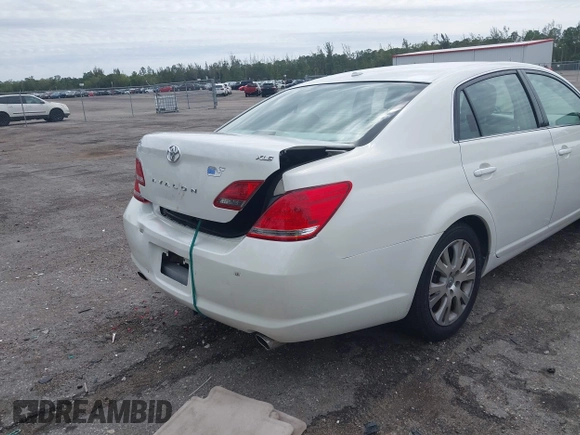 2010 Toyota Avalon XL with VIN 4T1BK3DB8AU354533, listed as a IAAI auction lot 41802797 with 117,956 mi miles and . Bid and sale history available at carsss.com. Image 18.