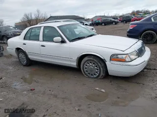 2004 Mercury Grand Marquis GS with VIN 2MEFM74W24X628573, listed as a IAAI auction lot 41922123 with 104,395 mi miles. Bid and sale history available at carsss.com. Image 13.