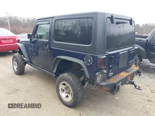 2013 Jeep Wrangler Rubicon 10th Anniversary with VIN 1C4BJWCG7DL544145, listed as a IAAI auction lot 41965259 with 125,900 mi miles and . Bid and sale history available at carsss.com. Image 3.