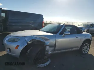 2007 Mazda MX-5 Miata Sport z VIN JM1NC25F170136105, wystawiony jako Copart lot #79251824 z przebiegiem 115 857 mil mil oraz Szkoda całkowita • Salvage title. Historia ofert i sprzedaży dostępna na DreamBid. Obrazek 1.