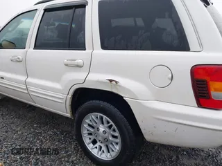 2002 Jeep Grand Cherokee Limited with VIN 1J8GX58N42C283956, listed as a IAAI auction lot 41553997 with 214,388 mi miles and . Bid and sale history available at DreamBid. Image 6.