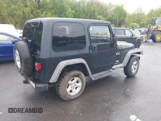 2004 Jeep Wrangler X with VIN 1J4FA39S94P707411, listed as a IAAI auction lot 42187856 with 189,519 mi miles. Bid and sale history available at carsss.com. Image 4.