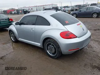 2012 Volkswagen Beetle 2.5L PZEV with VIN 3VWJP7ATXCM601206, listed as a IAAI auction lot 41733311 with 111,742 mi miles. Bid and sale history available at carsss.com. Image 3.