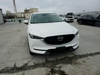 2021 Mazda CX-5 Grand Touring with VIN JM3KFBDM4M1344602, listed as a Copart auction lot 82793724 with 69,322 mi miles and Salvage Title. Bid and sale history available at carsss.com. Image 12.