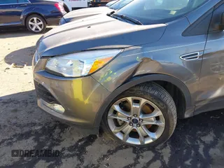 2014 Ford Escape Titanium with VIN 1FMCU9J94EUC50534, listed as a IAAI auction lot 41040341 with 115,502 mi miles. Bid and sale history available at carsss.com. Image 6.