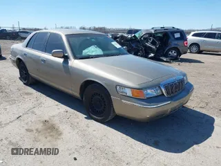 2001 Mercury Grand Marquis GS z VIN 2MEFM74W81X680253, wystawiony jako IAAI lot #41820444 z przebiegiem 94 183 mil mil oraz . Historia ofert i sprzedaży dostępna na DreamBid. Obrazek 1.