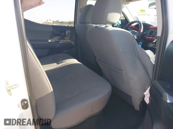 2018 Toyota Tacoma SR with VIN 5TFAX5GN2JX128621, listed as a IAAI auction lot 41797514 with 216,251 mi miles and . Bid and sale history available at DreamBid. Image 8.