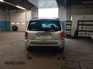 2009 Honda Pilot Touring with VIN 5FNYF48929B010331, listed as a IAAI auction lot 41965094 with 142,490 mi miles and . Bid and sale history available at carsss.com. Image 16.