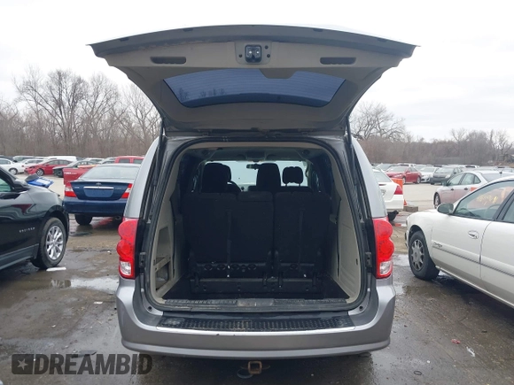 2014 Dodge Grand Caravan American Value with VIN 2C4RDGBG9ER187198, listed as a IAAI auction lot 41669334 with 204,803 mi miles and . Bid and sale history available at DreamBid. Image 18.