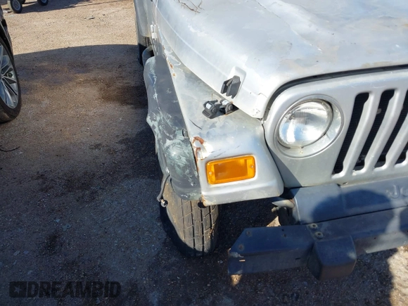 2004 Jeep Wrangler Sport Right Hand Drive with VIN 1J4F449SX4P780560, listed as a IAAI auction lot 41645721 with 146,681 mi miles. Bid and sale history available at carsss.com. Image 6.