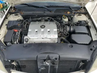 2003 Cadillac DeVille DTS z VIN 1G6KF57973U204531, wystawiony jako Copart lot #45712115 z przebiegiem 107 737 mil mil oraz Szkoda całkowita • Salvage title. Historia ofert i sprzedaży dostępna na DreamBid. Obrazek 11.