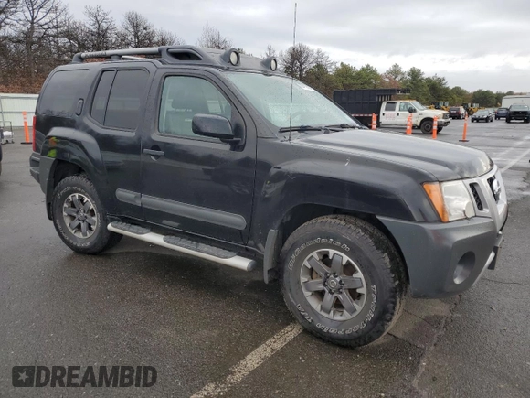 2014 Nissan Xterra X with VIN 5N1AN0NW5EN815643, listed as a Copart auction lot 85413894 with 43,413 mi miles and Salvage Title. Bid and sale history available at DreamBid. Image 4.