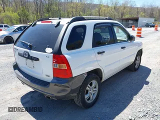 2006 Kia Sportage LX with VIN KNDJF723567151614, listed as a IAAI auction lot 42022102 with 128,564 mi miles and . Bid and sale history available at carsss.com. Image 4.