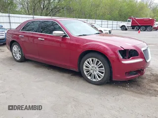 2012 Chrysler 300 C with VIN 2C3CCAKTXCH220185, listed as a IAAI auction lot 42110327 with 57,682 mi miles and . Bid and sale history available at DreamBid. Image 1.