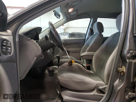 2002 Ford Focus ZX5 z VIN 3FAFP37352R180981, wystawiony jako Copart lot #55856125 z przebiegiem 59 785 mil mil oraz Szkoda całkowita • Salvage title. Historia ofert i sprzedaży dostępna na DreamBid. Obrazek 7.