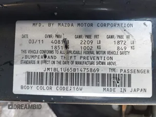 2011 Mazda Mazda3 s Sport with VIN JM1BL1U65B1475869, listed as a IAAI auction lot 41665008 with 59,300 mi miles. Bid and sale history available at carsss.com. Image 9.