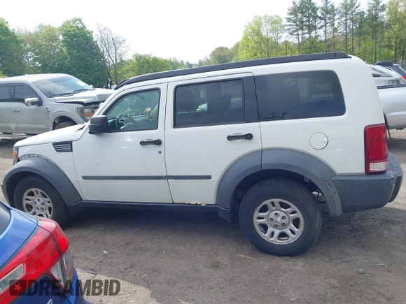 2007 Dodge Nitro SXT z VIN 1D8GU28K87W652037, wystawiony jako IAAI lot #42172950 z przebiegiem 172 487 mil mil oraz . Historia ofert i sprzedaży dostępna na DreamBid. Obrazek 14.