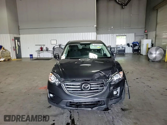 2016 Mazda CX-5 Touring z VIN JM3KE4CY5G0852073, wystawiony jako Copart lot #56599055 z przebiegiem 72 167 mil mil oraz Szkoda całkowita • Salvage title. Historia ofert i sprzedaży dostępna na DreamBid. Obrazek 14.