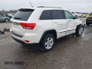 2012 Jeep Grand Cherokee Laredo with VIN 1C4RJFAG6CC297958, listed as a IAAI auction lot 40859811 with 213,499 mi miles. Bid and sale history available at carsss.com. Image 4.