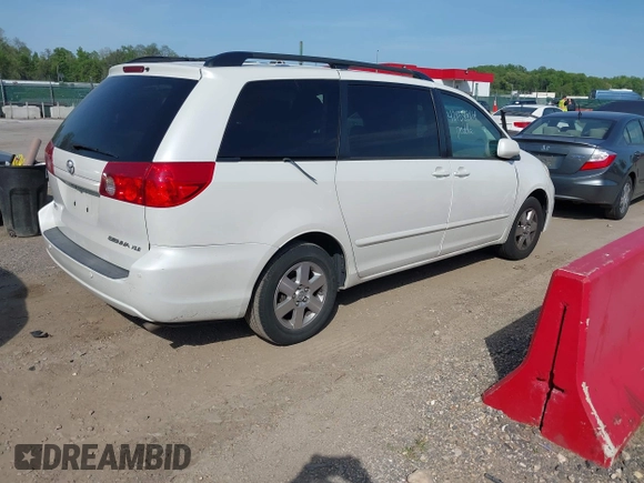 2009 Toyota Sienna XLE with VIN 5TDZK22C19S262107, listed as a IAAI auction lot 42158864 with 186,711 mi miles. Bid and sale history available at carsss.com. Image 4.