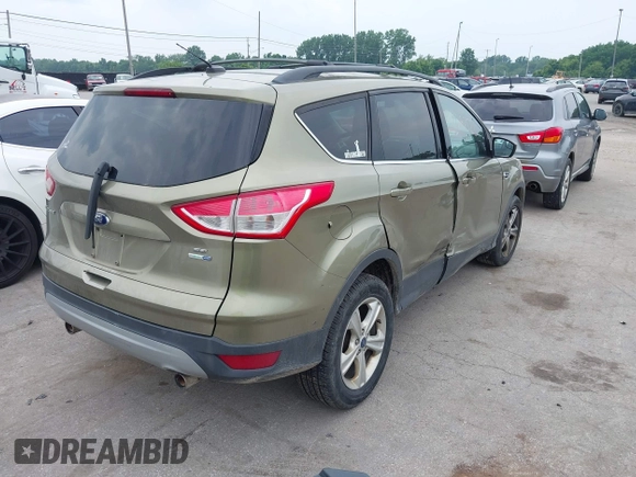 2013 Ford Escape SE with VIN 1FMCU9GX2DUC43098, listed as a IAAI auction lot 42687520 with 104,084 mi miles and . Bid and sale history available at DreamBid. Image 4.