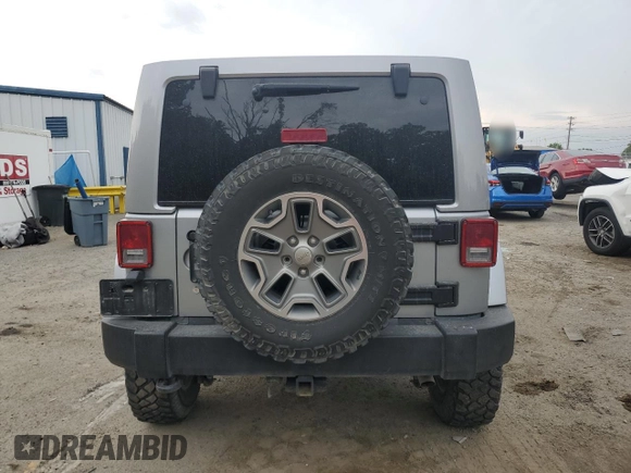 2018 Jeep Wrangler Unlimited Rubicon Recon z VIN 1C4HJWFGXJL840598, wystawiony jako Copart lot #59399595 z przebiegiem 63 298 mil mil oraz Szkoda całkowita • Salvage title. Historia ofert i sprzedaży dostępna na DreamBid. Obrazek 6.