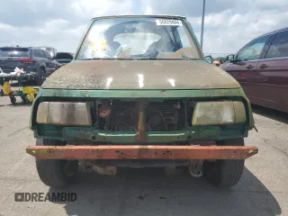 1994 Geo Tracker z VIN 2CNBE18U4R6933505, wystawiony jako Copart lot #68421924 z przebiegiem 203 558 mil mil oraz Szkody całkowita. Historia ofert i sprzedaży dostępna na DreamBid. Obrazek 5.