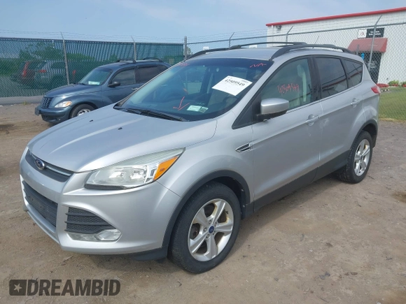 2014 Ford Escape SE z VIN 1FMCU9GX3EUB83978, wystawiony jako IAAI lot #42509549 z przebiegiem 121 388 mil mil oraz . Historia ofert i sprzedaży dostępna na DreamBid. Obrazek 2.