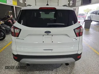 2018 Ford Escape SE z VIN 1FMCU9GD4JUA76194, wystawiony jako IAAI lot #42421138 z przebiegiem 47 896 mil mil oraz . Historia ofert i sprzedaży dostępna na DreamBid. Obrazek 14.