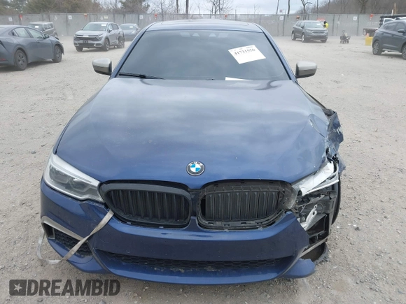 2018 BMW 5 Series M550i xDrive with VIN WBAJB9C56JG463891, listed as a IAAI auction lot 41731556 with 104,860 mi miles. Bid and sale history available at carsss.com. Image 12.