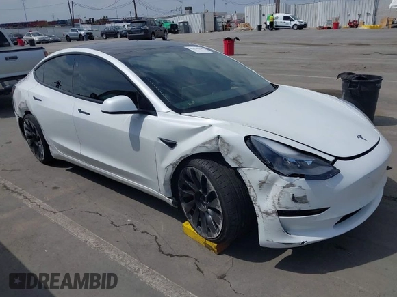 2021 Tesla Model 3 Performance with VIN 5YJ3E1EC2MF084594, listed as a IAAI auction lot 42030339 with 43,215 mi miles and . Bid and sale history available at DreamBid. Image 1.