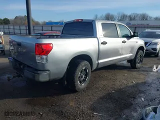 2010 Toyota Tundra 4WD Truck with VIN 5TFDW5F11AX142704, listed as a IAAI auction lot 41230112 with 201,697 mi miles. Bid and sale history available at carsss.com. Image 4.
