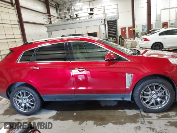 2016 Cadillac SRX Performance Collection z VIN 3GYFNCE32GS571230, wystawiony jako IAAI lot #42417263 z przebiegiem 59 634 mil mil oraz . Historia ofert i sprzedaży dostępna na DreamBid. Obrazek 13.